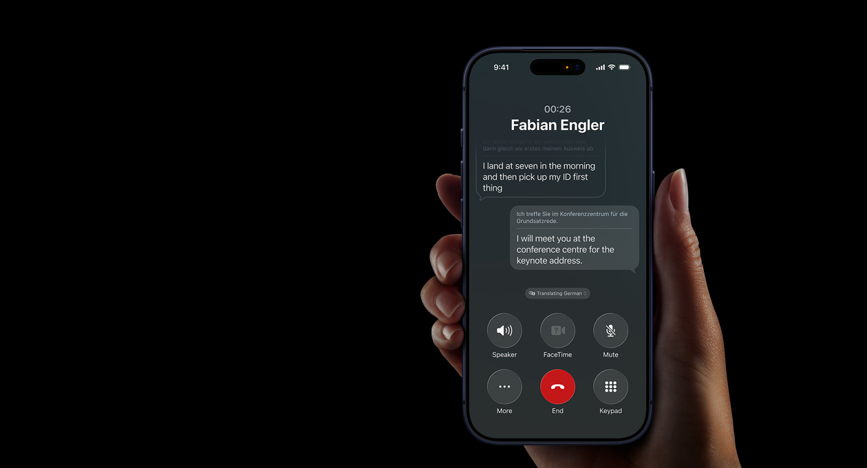 A hand holds iPhone 17 Pro, demonstrating the Apple Intelligence Live Translation feature during a phone call